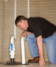 Plumbing contractor in San Jose inspects a PVC connection